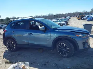 2016 Mazda CX-5 Grand Touring with VIN JM3KE2DY2G0715272, listed as a IAAI auction lot 41590492 with 134,176 mi miles. Bid and sale history available at carsss.com. Image 14.