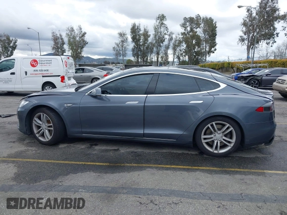 2013 Tesla Model S with VIN 5YJSA1CN8DFP21869, listed as a IAAI auction lot 41772603 with Not provided miles and . Bid and sale history available at DreamBid. Image 13.