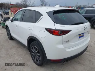 2018 Mazda CX-5 Touring z VIN JM3KFBCM6J0323107, wystawiony jako IAAI lot #41895519 z przebiegiem 86 124 mil mil oraz . Historia ofert i sprzedaży dostępna na DreamBid. Obrazek 3.
