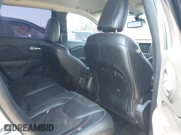 2014 Jeep Cherokee Trailhawk z VIN 1C4PJMBSXEW273520, wystawiony jako IAAI lot #42569063 z przebiegiem 137 585 mil mil oraz . Historia ofert i sprzedaży dostępna na DreamBid. Obrazek 8.