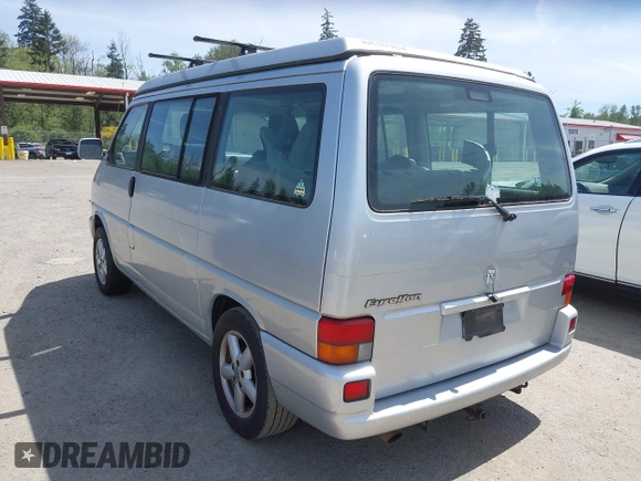 2003 Volkswagen EuroVan MV with VIN WV2NB47003H003131, listed as a IAAI auction lot 42157821 with 166,159 mi miles and . Bid and sale history available at DreamBid. Image 3.