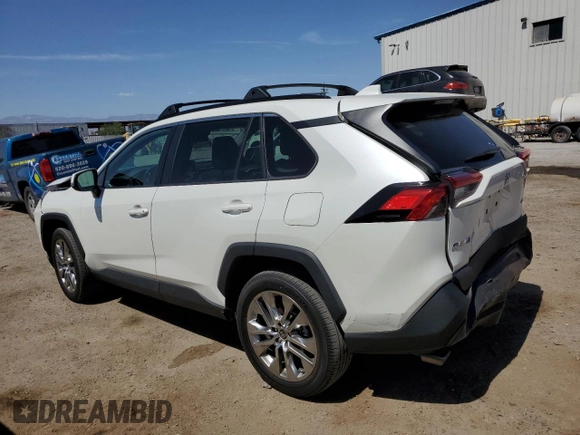 2021 Toyota RAV4 XLE Premium with VIN 2T3C1RFV0MW153089, listed as a Copart auction lot 60759615 with 28,153 mi miles and Salvage title. Bid and sale history available at DreamBid. Image 2.