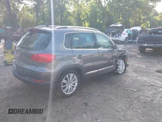 2013 Volkswagen Tiguan S with VIN WVGAV3AX7DW624136, listed as a IAAI auction lot 42256657 with 124,000 mi miles and . Bid and sale history available at DreamBid. Image 4.