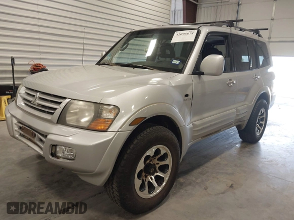 2002 Mitsubishi Montero Limited z VIN JA4MW51RX2J048087, wystawiony jako IAAI lot #42096678 z przebiegiem 218 795 mil mil oraz . Historia ofert i sprzedaży dostępna na DreamBid. Obrazek 2.