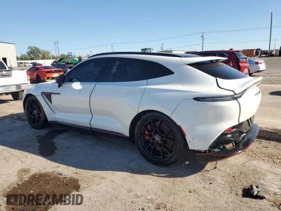2021 Aston Martin DBX z VIN SCFVUJAW8MTV02134, wystawiony jako Copart lot #72456004 z przebiegiem Nie podano mil oraz Szkoda całkowita • Salvage title. Historia ofert i sprzedaży dostępna na DreamBid. Obrazek 2.