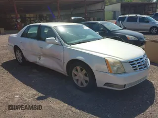 2006 Cadillac DTS w/1SC with VIN 1G6KD57Y56U132648, listed as a IAAI auction lot 41862030 with 128,003 mi miles. Bid and sale history available at carsss.com. Image 1.