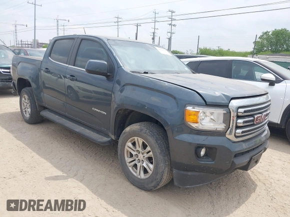 2019 GMC Canyon 4WD SLE z VIN 1GTG6CENXK1261278, wystawiony jako IAAI lot #42064295 z przebiegiem 51 786 mil mil oraz . Historia ofert i sprzedaży dostępna na DreamBid. Obrazek 1.