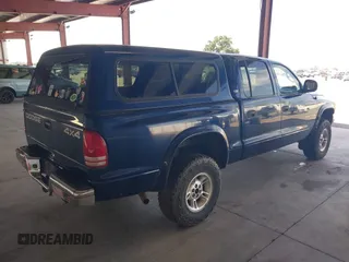 2000 Dodge Dakota Sport with VIN 1B7GG2AN7YS647799, listed as a IAAI auction lot 42147404 with 234,194 mi miles and . Bid and sale history available at carsss.com. Image 4.