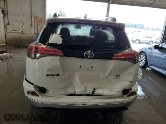 2016 Toyota RAV4 SE with VIN JTMJFREV0GD190302, listed as a Copart auction lot 59330345 with 102,069 mi miles and Salvage title. Bid and sale history available at DreamBid. Image 6.