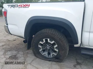 2023 Toyota Tacoma SR with VIN 3TMCZ5AN1PM556299, listed as a IAAI auction lot 42344160 with 42,338 mi miles and . Bid and sale history available at DreamBid. Image 19.