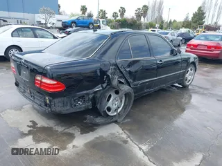 2000 Mercedes-Benz E-Class with VIN WDBJF65JXYA997410, listed as a IAAI auction lot 41939485 with 158,559 mi miles. Bid and sale history available at carsss.com. Image 4.