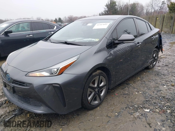 2019 Toyota Prius L Eco z VIN JTDKARFU8K3085918, wystawiony jako IAAI lot #41107891 z przebiegiem 166 295 mil mil oraz . Historia ofert i sprzedaży dostępna na DreamBid. Obrazek 2.