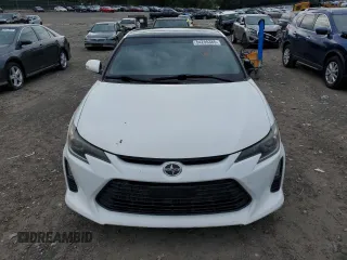 2014 Scion tC z VIN JTKJF5C70E3084411, wystawiony jako Copart lot #54255385 z przebiegiem 152 715 mil mil oraz Szkody całkowita. Historia ofert i sprzedaży dostępna na DreamBid. Obrazek 5.