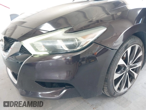 2016 Nissan Maxima SV with VIN 1N4AA6AP5GC413563, listed as a IAAI auction lot 42196144 with 209,711 mi miles and . Bid and sale history available at DreamBid. Image 6.