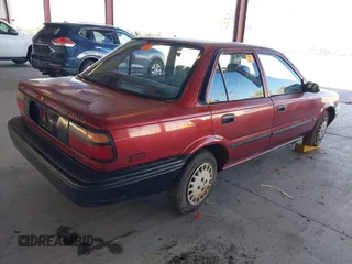 1990 Toyota Corolla z VIN 1NXAE94A1LZ117401, wystawiony jako IAAI lot #41755431 z przebiegiem 81 786 mil mil oraz . Historia ofert i sprzedaży dostępna na DreamBid. Obrazek 4.
