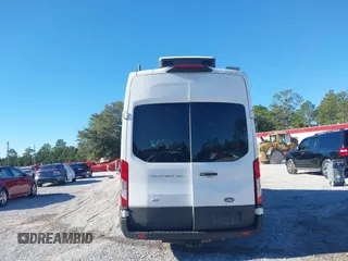 2022 Ford Transit Cargo with VIN 1FTBW3U85NKA01097, listed as a IAAI auction lot 41076643 with 24,786 mi miles and . Bid and sale history available at DreamBid. Image 16.