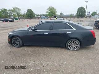 2014 Cadillac CTS Luxury AWD with VIN 1G6AX5SX9E0197395, listed as a IAAI auction lot 42211452 with 90,657 mi miles and . Bid and sale history available at DreamBid. Image 14.