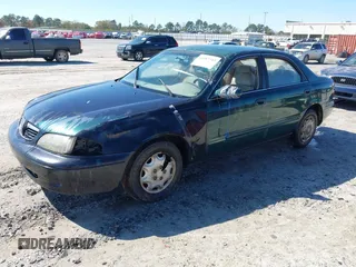 1999 Mazda 626 ES with VIN 1YVGF22C2X5859646, listed as a IAAI auction lot 41887343 with 1 mi miles. Bid and sale history available at carsss.com. Image 2.