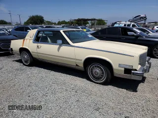 1985 Cadillac Eldorado z VIN 1G6EL5782FE675028, wystawiony jako Copart lot #57709655 z przebiegiem 63 347 mil mil oraz Tytuł czysty. Historia ofert i sprzedaży dostępna na DreamBid. Obrazek 4.