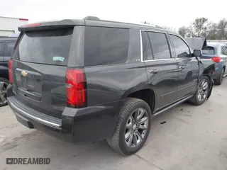 2015 Chevrolet Tahoe LTZ with VIN 1GNSCCKC7FR614886, listed as a IAAI auction lot 41679585 with 104,695 mi miles. Bid and sale history available at carsss.com. Image 4.