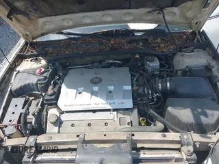 2000 Cadillac DeVille DTS z VIN 1G6KF5792YU216318, wystawiony jako IAAI lot #42134531 z przebiegiem 167 518 mil mil oraz . Historia ofert i sprzedaży dostępna na DreamBid. Obrazek 10.