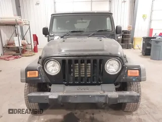 2006 Jeep Wrangler Sport Right Hand Drive with VIN 1J4F449S56P741328, listed as a IAAI auction lot 41476847 with 67,203 mi miles. Bid and sale history available at carsss.com. Image 6.