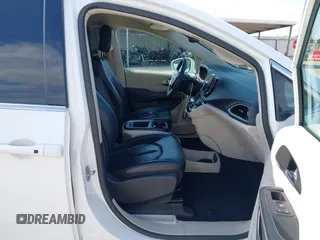 2022 Chrysler Pacifica Touring L with VIN 2C4RC1BG8NR197706, listed as a IAAI auction lot 42414290 with 56,972 mi miles and . Bid and sale history available at DreamBid. Image 5.