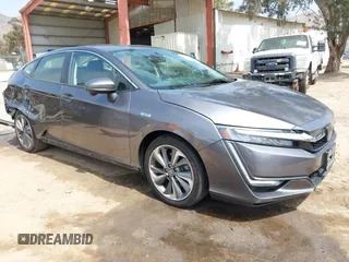 2018 Honda Clarity with VIN JHMZC5F12JC013732, listed as a IAAI auction lot 42157758 with 162,470 mi miles. Bid and sale history available at carsss.com. Image 1.