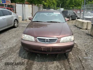 2000 Mazda 626 LX z VIN 1YVGF22C4Y5112874, wystawiony jako Copart lot #58952175 z przebiegiem 100 070 mil mil oraz Szkoda całkowita • Salvage title. Historia ofert i sprzedaży dostępna na DreamBid. Obrazek 5.