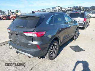 2020 Ford Escape Titanium with VIN 1FMCU9J9XLUA66440, listed as a IAAI auction lot 41464049 with 57,626 mi miles and . Bid and sale history available at DreamBid. Image 4.