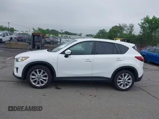 2015 Mazda CX-5 Grand Touring with VIN JM3KE4DY5F0530854, listed as a IAAI auction lot 42274582 with 144,732 mi miles and . Bid and sale history available at DreamBid. Image 14.