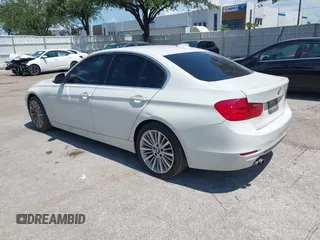 2014 BMW 3 Series 328i with VIN WBA3A5C54EP600398, listed as a IAAI auction lot 42665302 with 117,012 mi miles and . Bid and sale history available at DreamBid. Image 3.