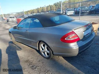 2005 Mercedes-Benz CLK-Class 5.0L with VIN WDBTK75J85F126398, listed as a IAAI auction lot 41890954 with 124,554 mi miles. Bid and sale history available at carsss.com. Image 3.