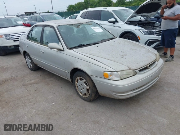 1999 Toyota Corolla VE z VIN 2T1BR12E7XC154444, wystawiony jako IAAI lot #42514069 z przebiegiem 209 377 mil mil oraz . Historia ofert i sprzedaży dostępna na DreamBid. Obrazek 1.