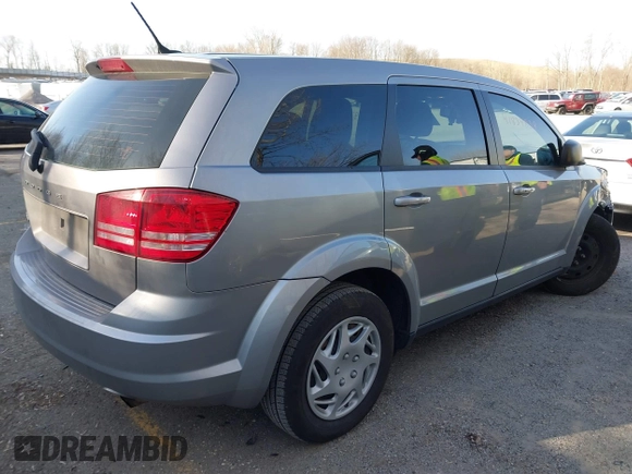 2015 Dodge Journey SE z VIN 3C4PDCAB7FT719679, wystawiony jako IAAI lot #41839838 z przebiegiem 119 610 mil mil oraz . Historia ofert i sprzedaży dostępna na DreamBid. Obrazek 4.