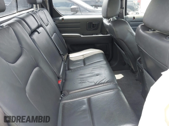 2011 Honda Ridgeline RTL with VIN 5FPYK1F54BB011472, listed as a IAAI auction lot 42112512 with 194,974 mi miles and . Bid and sale history available at DreamBid. Image 8.
