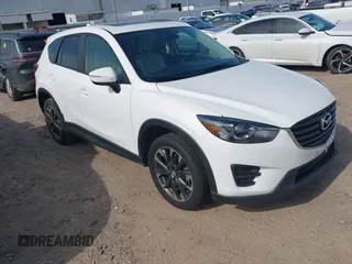 2016 Mazda CX-5 Grand Touring z VIN JM3KE2DY7G0621114, wystawiony jako IAAI lot #42267556 z przebiegiem 160 266 mil mil oraz . Historia ofert i sprzedaży dostępna na DreamBid. Obrazek 1.