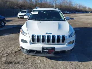 2015 Jeep Cherokee Latitude with VIN 1C4PJMCB3FW734573, listed as a IAAI auction lot 41825561 with 141,250 mi miles. Bid and sale history available at carsss.com. Image 13.