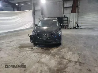 2016 Mazda CX-5 Grand Touring with VIN JM3KE4DY6G0655802, listed as a Copart auction lot 43820475 with 76,639 mi miles and Salvage Title. Bid and sale history available at carsss.com. Image 12.