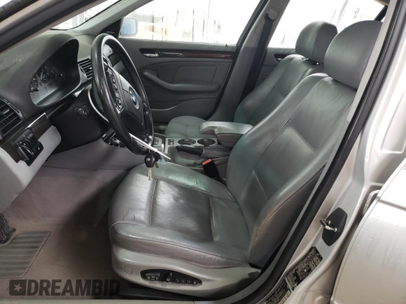 2000 BMW 3 Series 323i with VIN WBAAM3348YFP73443, listed as a Copart auction lot 54165575 with 334,761 mi miles and Salvage title. Bid and sale history available at DreamBid. Image 7.
