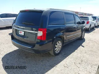 2013 Chrysler Town & Country Touring with VIN 2C4RC1BGXER216837, listed as a IAAI auction lot 41813424 with 216,395 mi miles and . Bid and sale history available at DreamBid. Image 4.