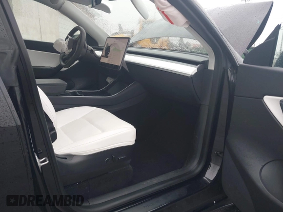 2021 Tesla Model Y Standard Range with VIN 5YJYGDED9MF103989, listed as a IAAI auction lot 41482268 with 33,485 mi miles and . Bid and sale history available at DreamBid. Image 5.