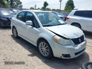 2008 Suzuki SX4 Touring 2 z VIN JS2YC417285100960, wystawiony jako IAAI lot #42166346 z przebiegiem 162 498 mil mil oraz . Historia ofert i sprzedaży dostępna na DreamBid. Obrazek 1.