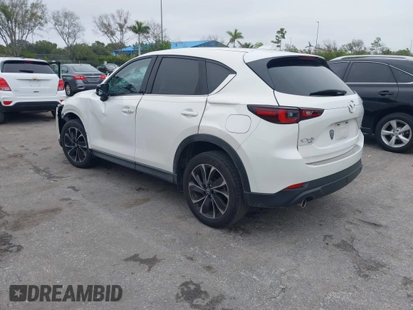 2023 Mazda CX-5 2.5 S Premium Package with VIN JM3KFBDM1P0126787, listed as a IAAI auction lot 41164586 with 12,076 mi miles. Bid and sale history available at carsss.com. Image 3.