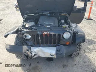 2012 Jeep Wrangler Unlimited Sahara with VIN 1C4HJWEG5CL205826, listed as a Copart auction lot 58222115 with 98,940 mi miles and Salvage title. Bid and sale history available at DreamBid. Image 12.