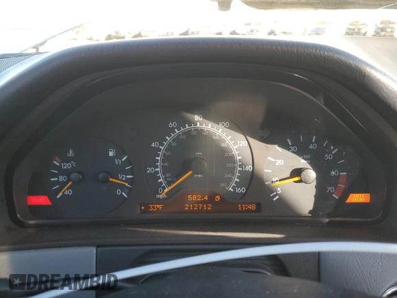 1999 Mercedes-Benz E-Class with VIN WDBJF82H1XX024280, listed as a Copart auction lot 83213204 with 212,712 mi miles and Salvage Title. Bid and sale history available at carsss.com. Image 9.
