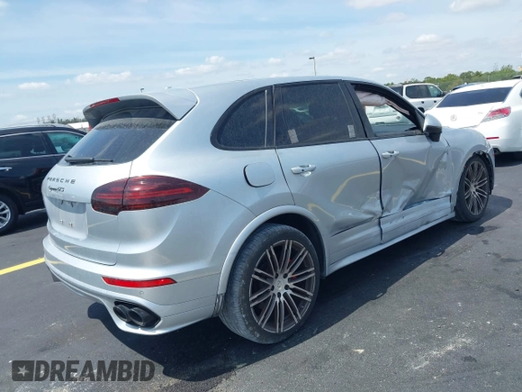 2016 Porsche Cayenne GTS z VIN WP1AD2A27GLA76018, wystawiony jako IAAI lot #42209515 z przebiegiem 49 432 mil mil oraz . Historia ofert i sprzedaży dostępna na DreamBid. Obrazek 4.