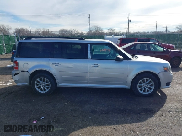 2016 Ford Flex SE z VIN 2FMGK5B8XGBA23900, wystawiony jako IAAI lot #41599714 z przebiegiem 102 961 mil mil oraz . Historia ofert i sprzedaży dostępna na DreamBid. Obrazek 13.