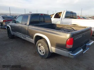 2002 Dodge Dakota SLT with VIN 1B7GL42X42S682184, listed as a IAAI auction lot 41784688 with 168,298 mi miles. Bid and sale history available at carsss.com. Image 3.