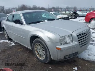 2009 Chrysler 300 Touring with VIN 2C3KA53V29H631534, listed as a IAAI auction lot 41972359 with 157,736 mi miles. Bid and sale history available at carsss.com. Image 1.